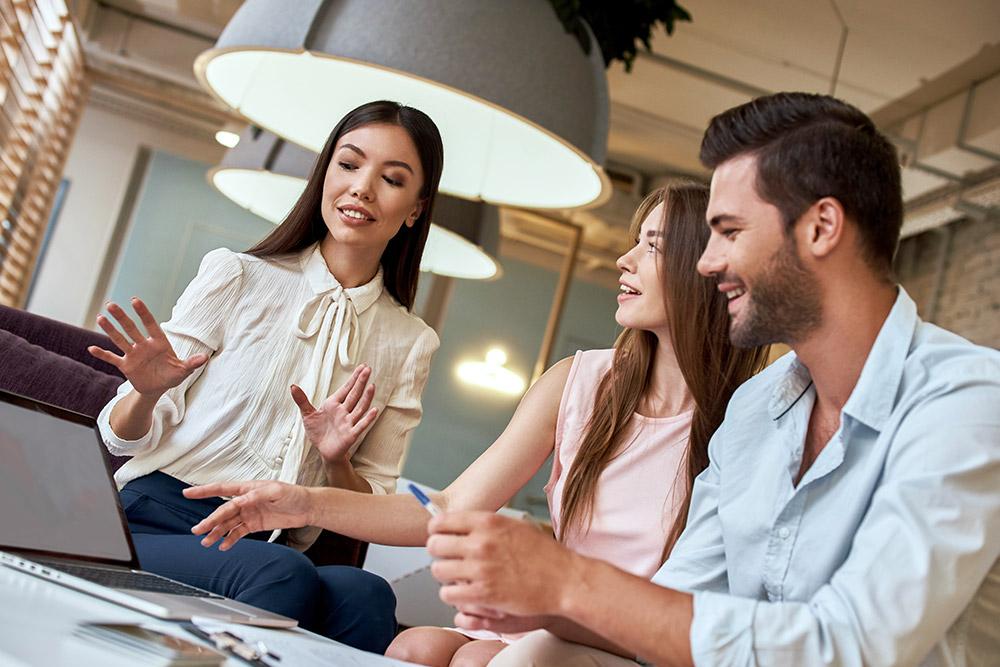 Travel consultant discussing with couple their upcoming travel plans